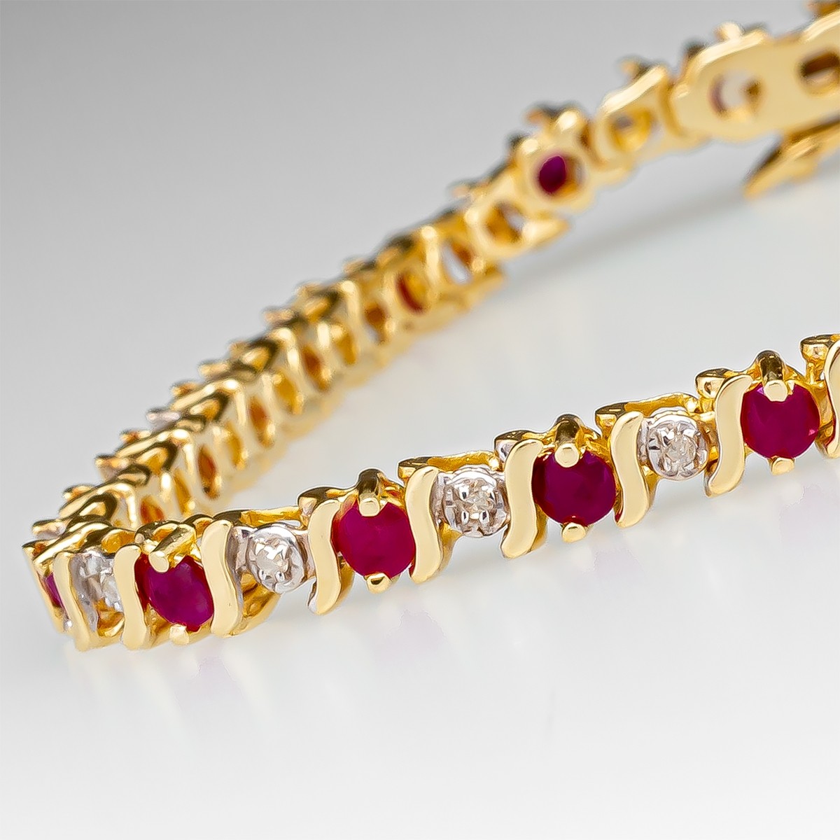 Color Merchants 14k White Gold Natural Ruby And Diamond Tennis Bracelet   KP Jewelers