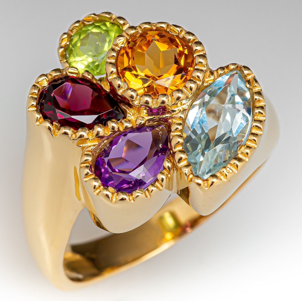 Lot - MULTI-COLOR GEMSTONE AND GOLD RING