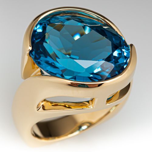 Oval Cut Blue Topaz Cocktail Ring 14K Yellow Gold